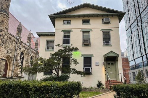 The Greenfield Intercultural Center on 37th and Chestnut streets. Photo shows a beige building with green window trims and door. Photo courtesy of The Penn Disorientation Guide.